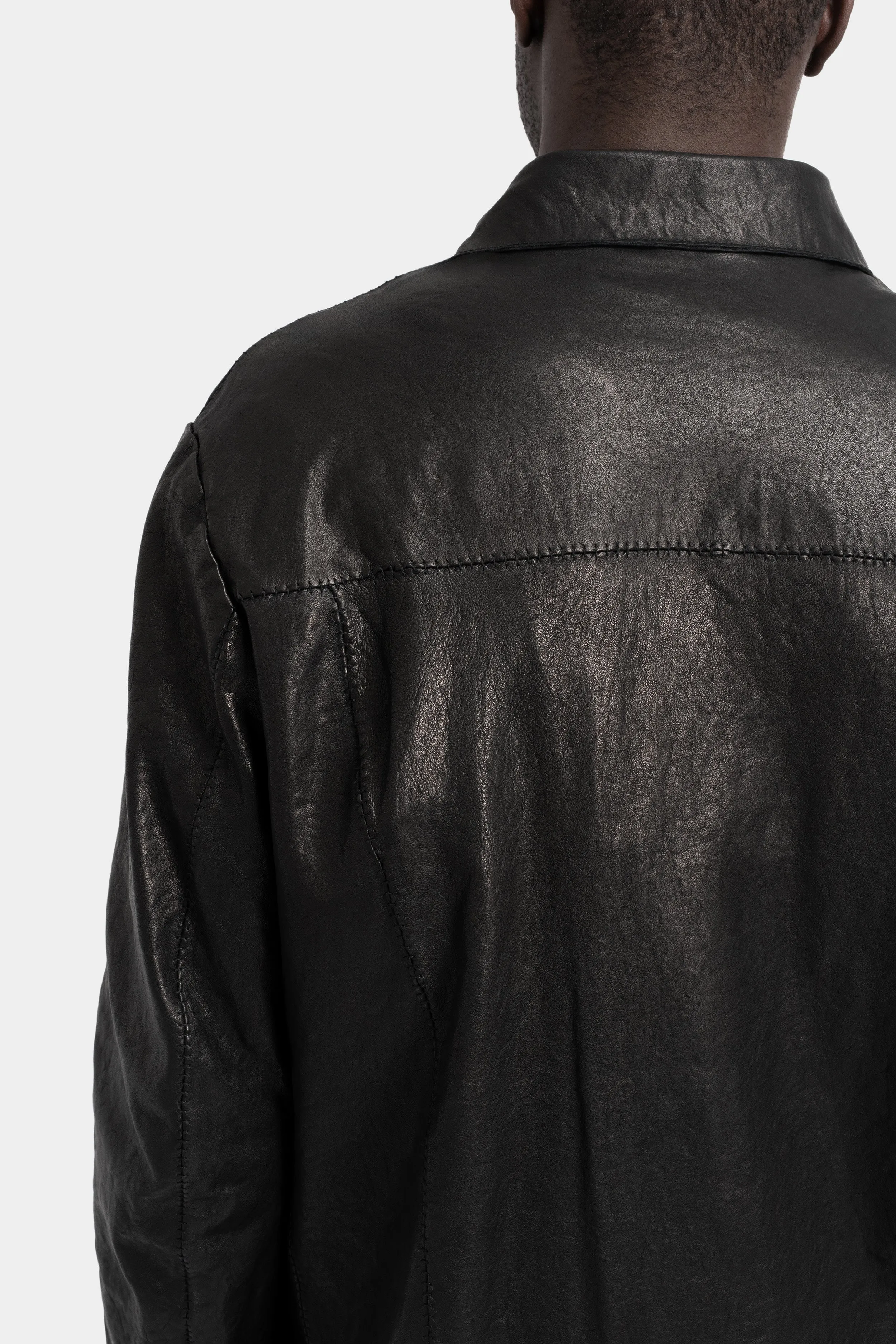 Buttoned up leather over shirt