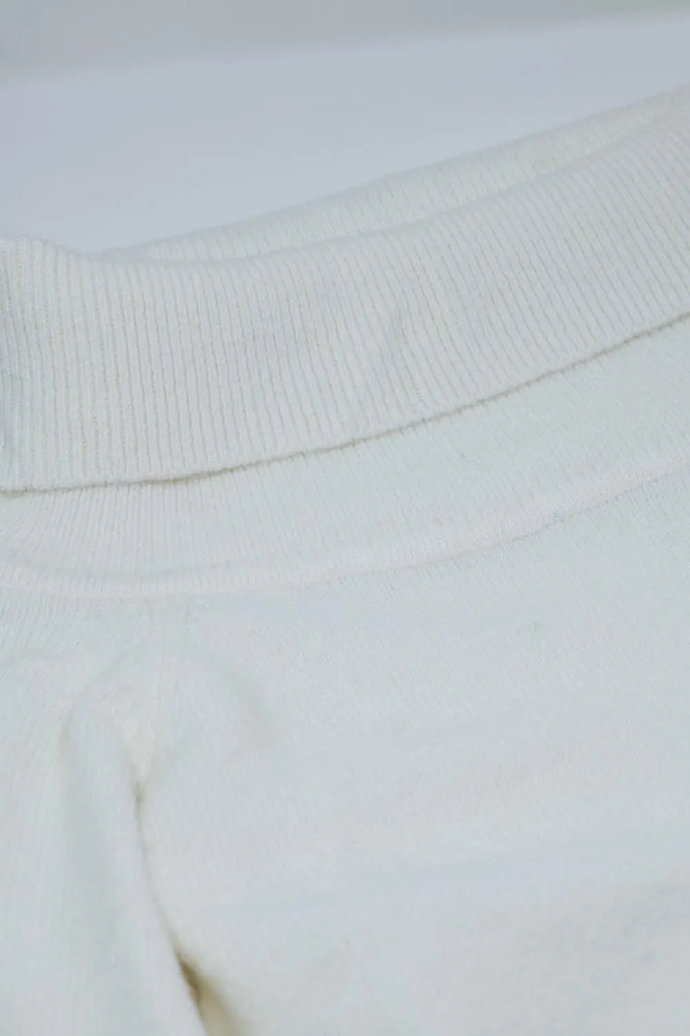 White sweater with a boat neckline